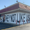 ABC Channel 7 News - Iconic Tam's Burgers 'Not Like Us' Mural